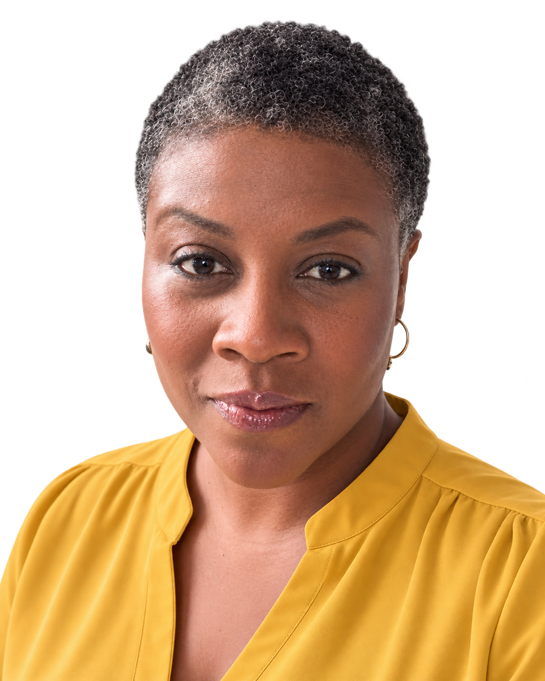 Confident portrait of Nayma Freedom in a mustard gold top